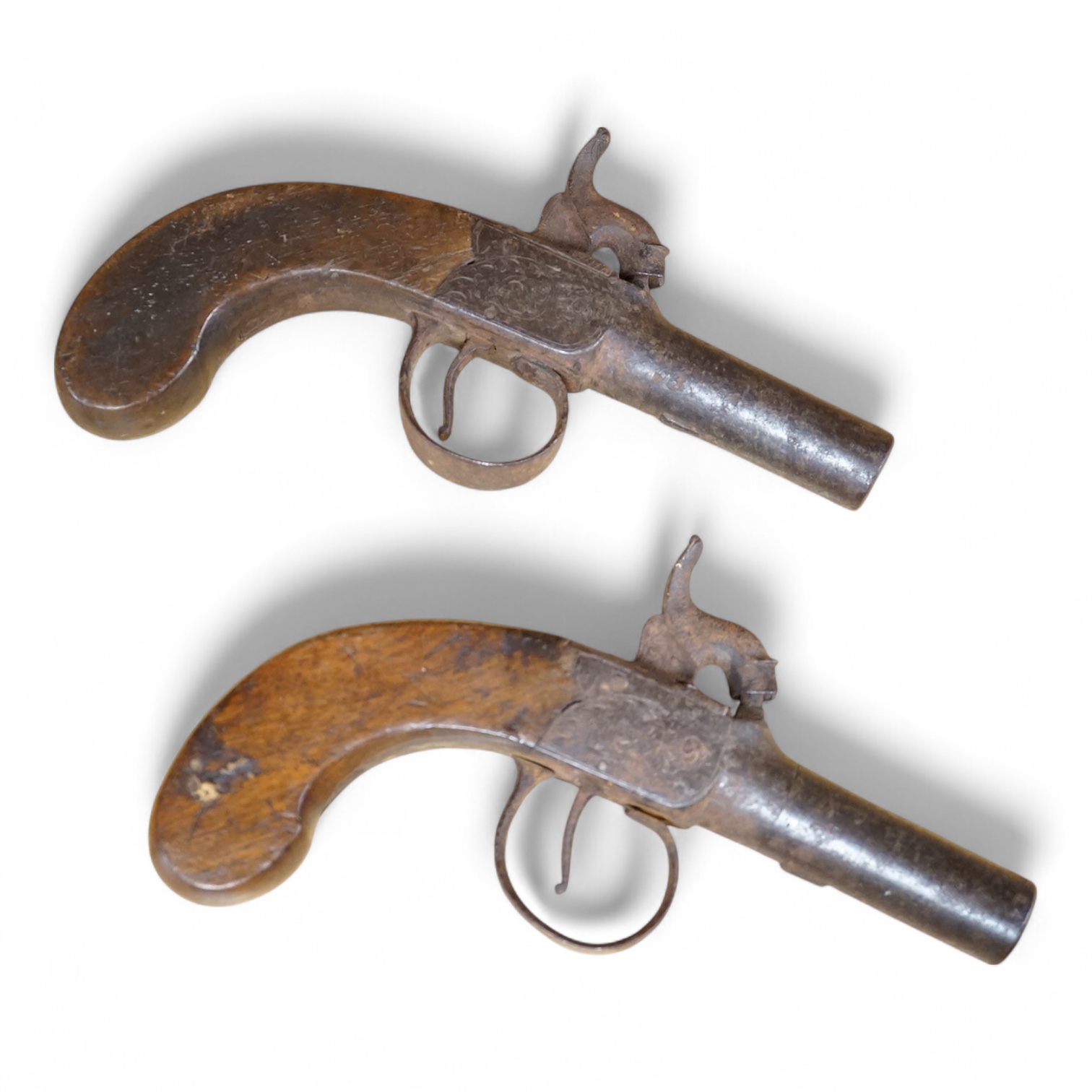 A pair of percussion cap pistols with turn off 5cm barrels, the frames engraved Noch, London, Birmingham proved, slab walnut butts (2)